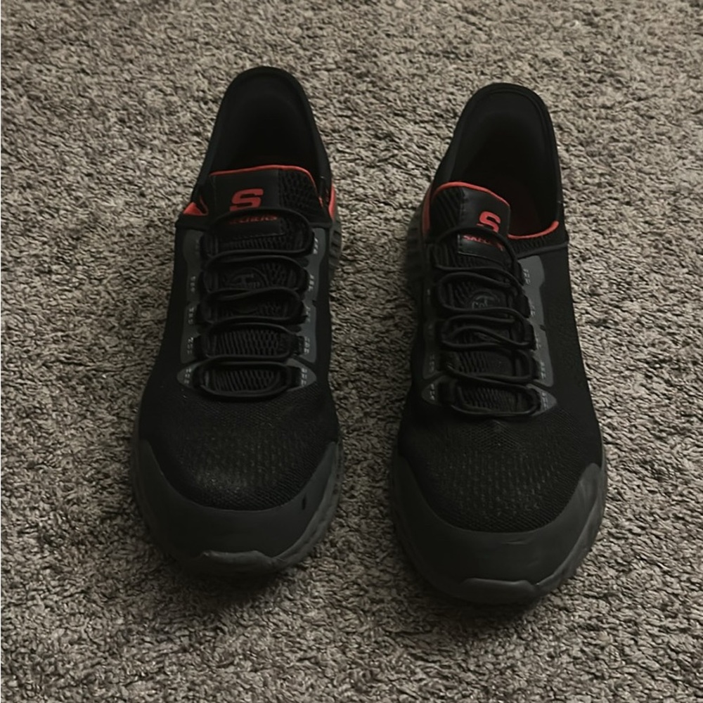 Black and Gray Sneakers with Red Accents -sketchers steel toe shoe